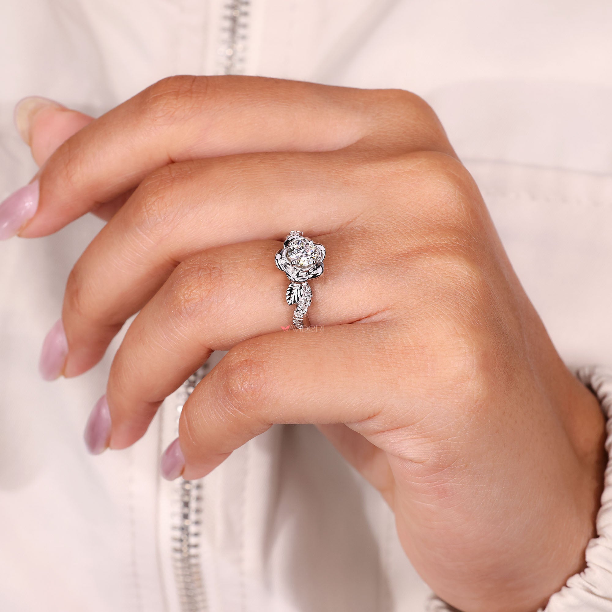 Unique round diamond engagement ring in white gold.