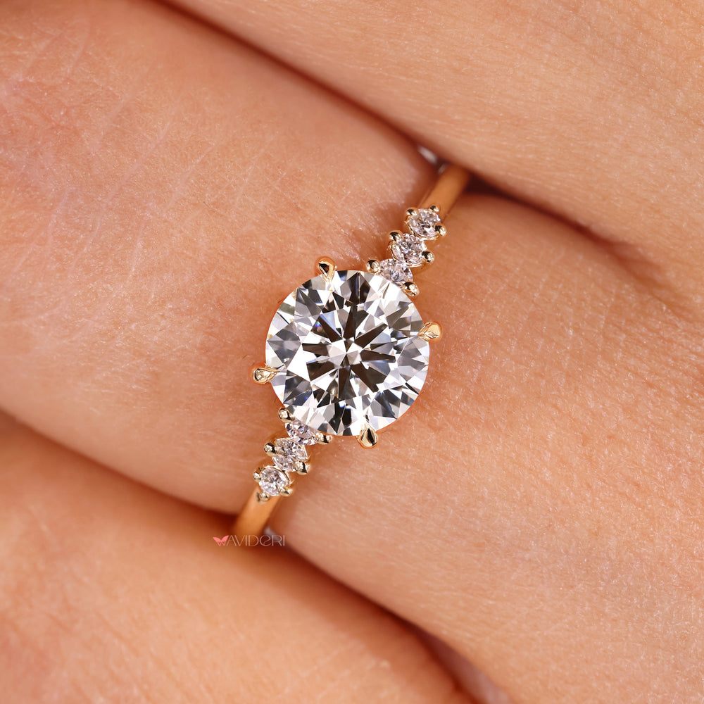 Round diamond engagement ring with 4 claw prong setting.