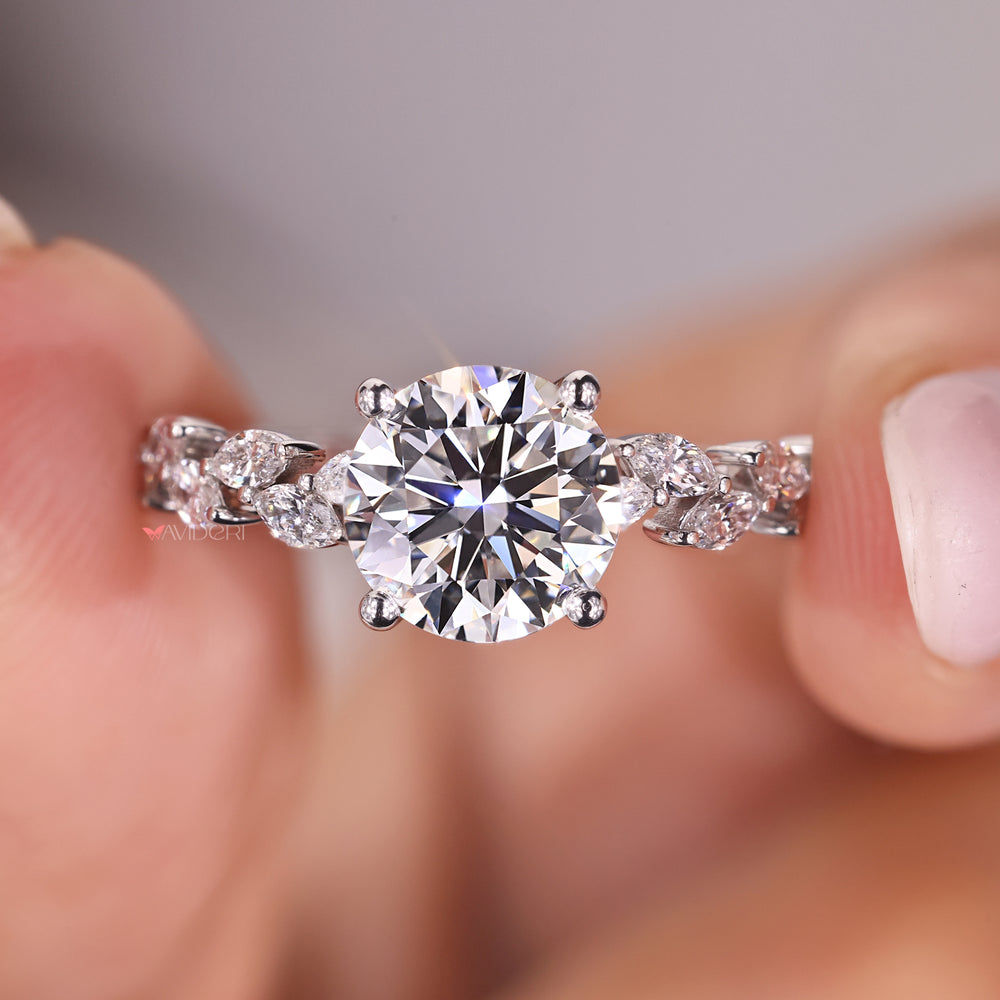 Buy engagement ring online featuring a round diamond and pave setting for extra shine.