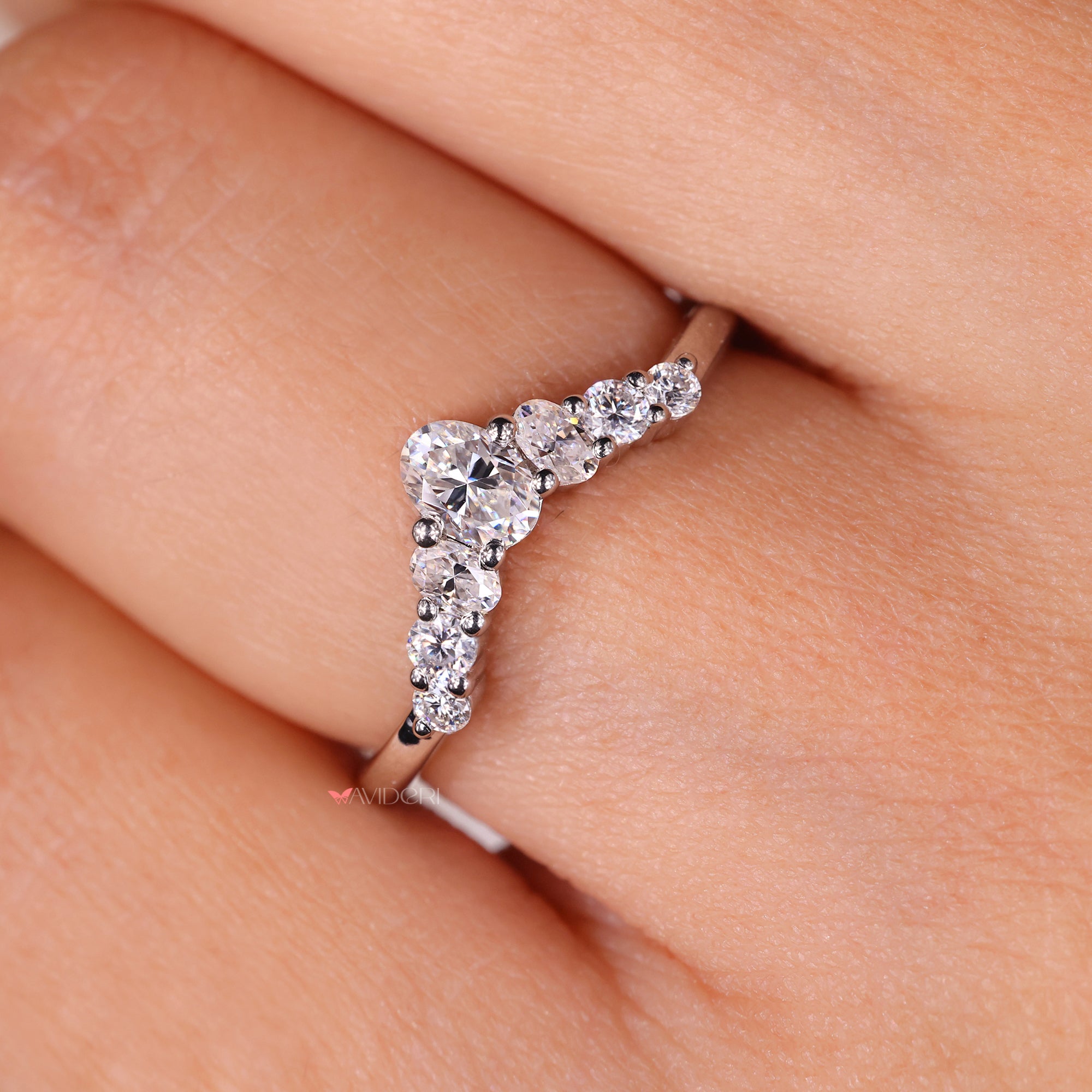 Oval cut wedding band with Seven Stone Band.