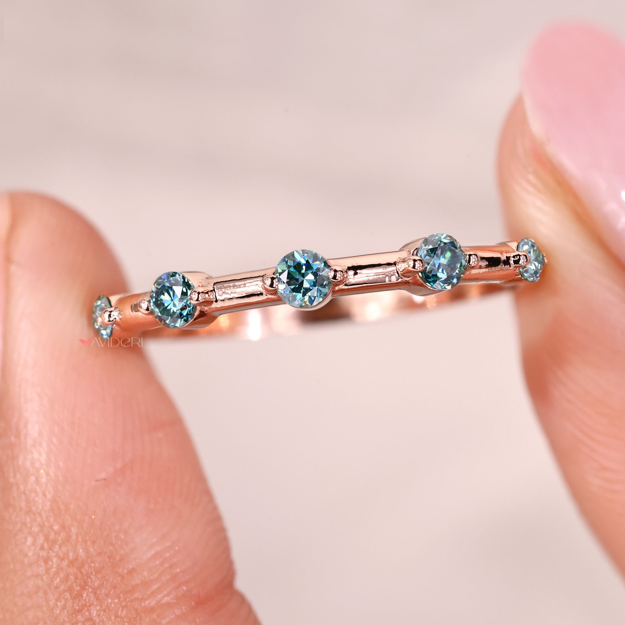 Avideri wedding band combines timeless elegance with contemporary moissanite detailing.