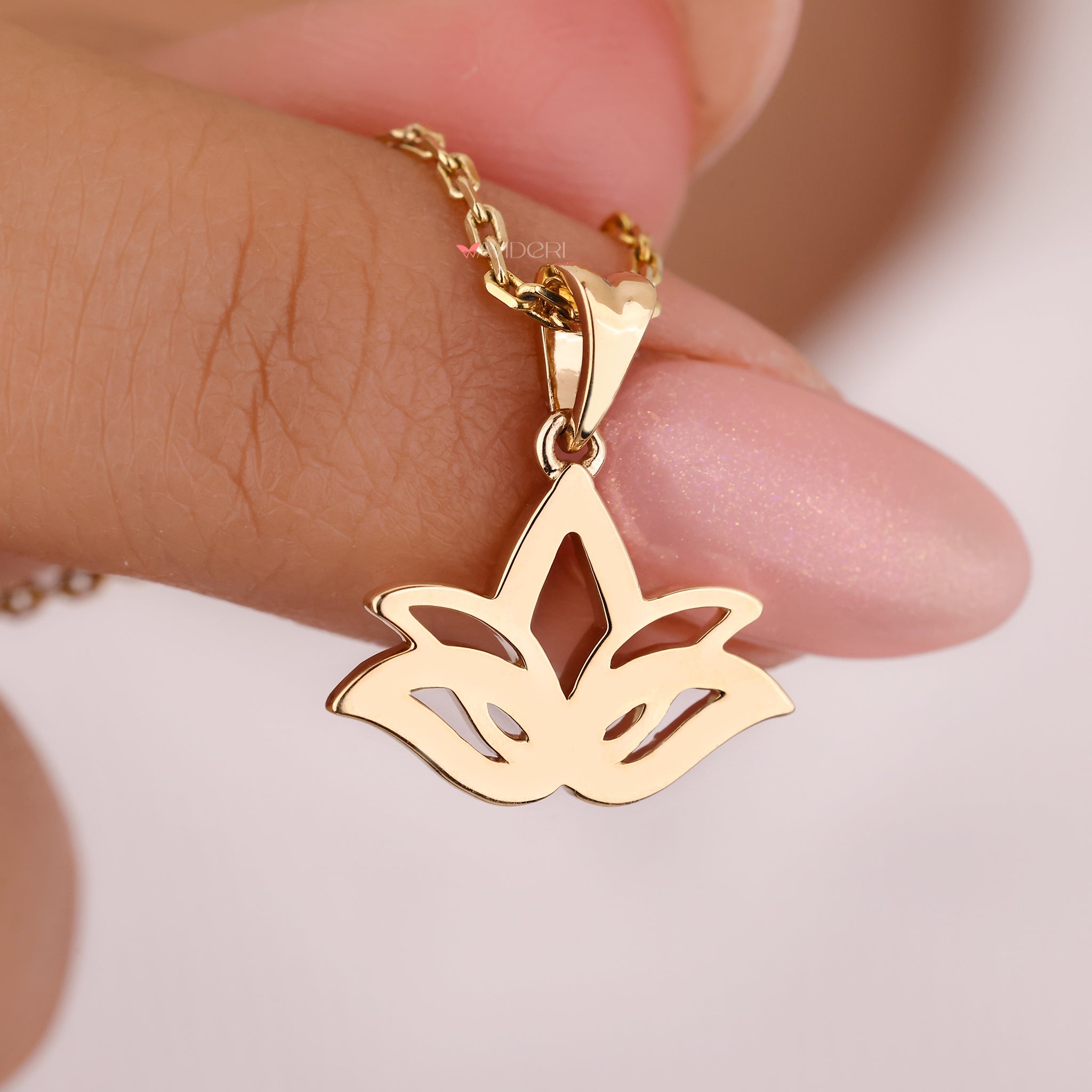 The yellow gold pendant provides a warm, polished finish.