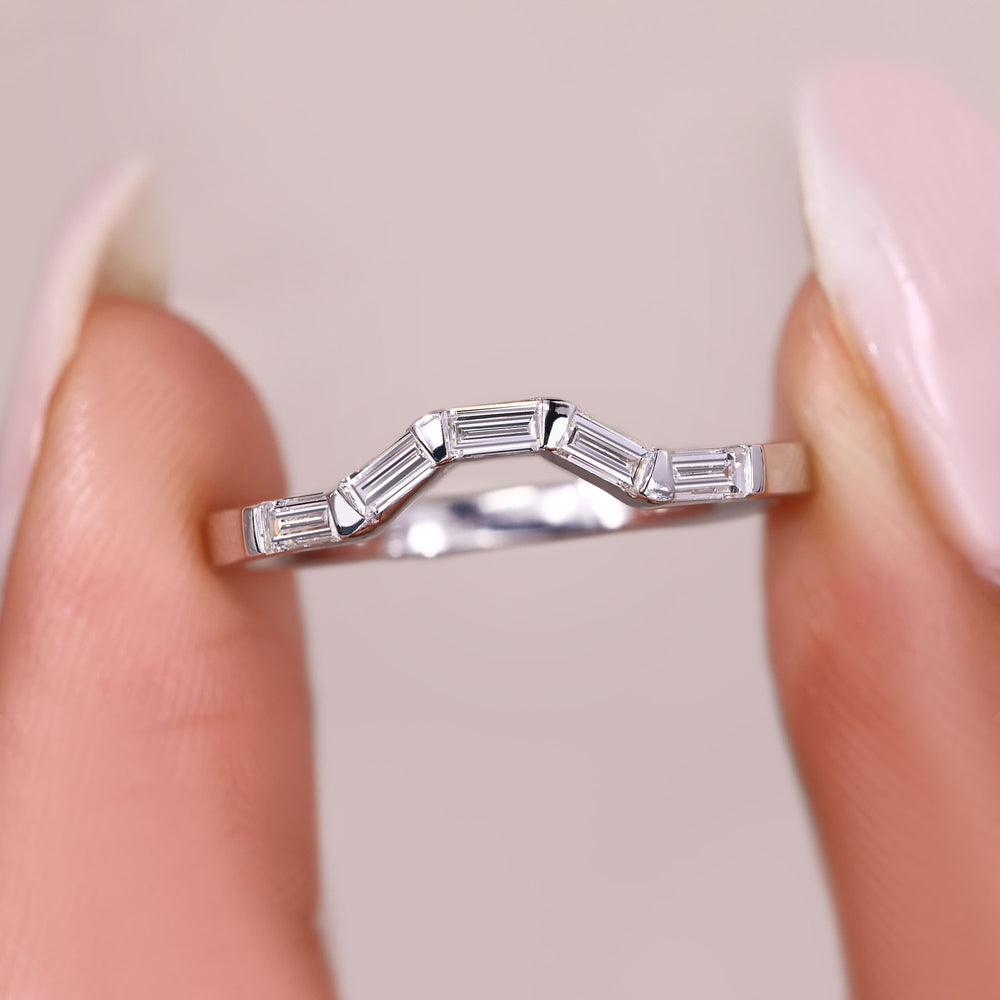 Curved diamond band with baguette cut stones.
