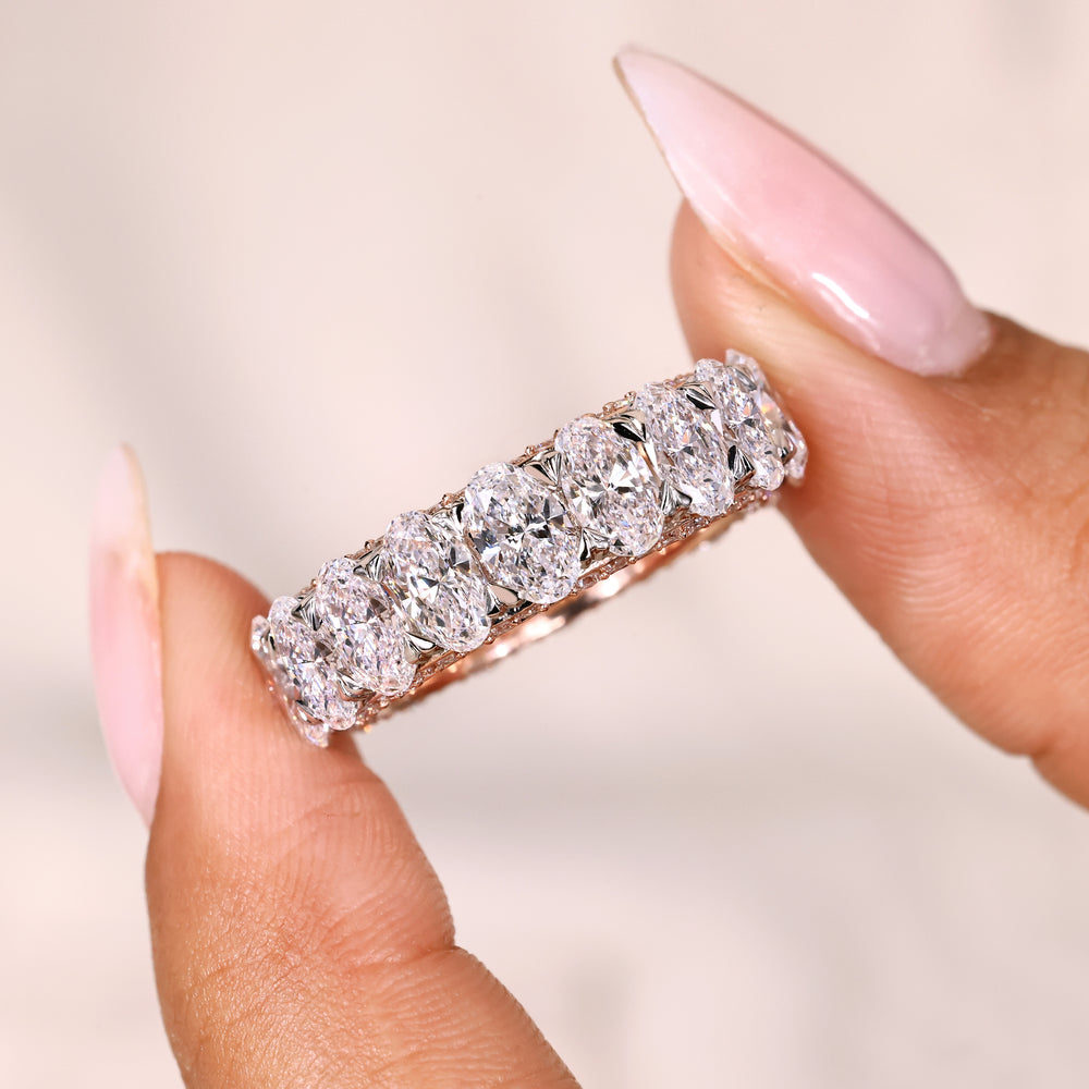 Eternity oval diamond band with pave design.
