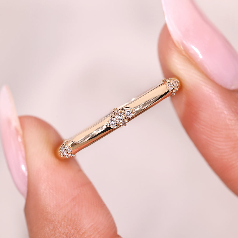 Distance pave round diamond band prong set.
