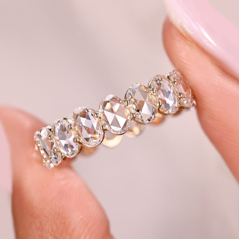 Lab grown diamond eternity band with shared prongs.
