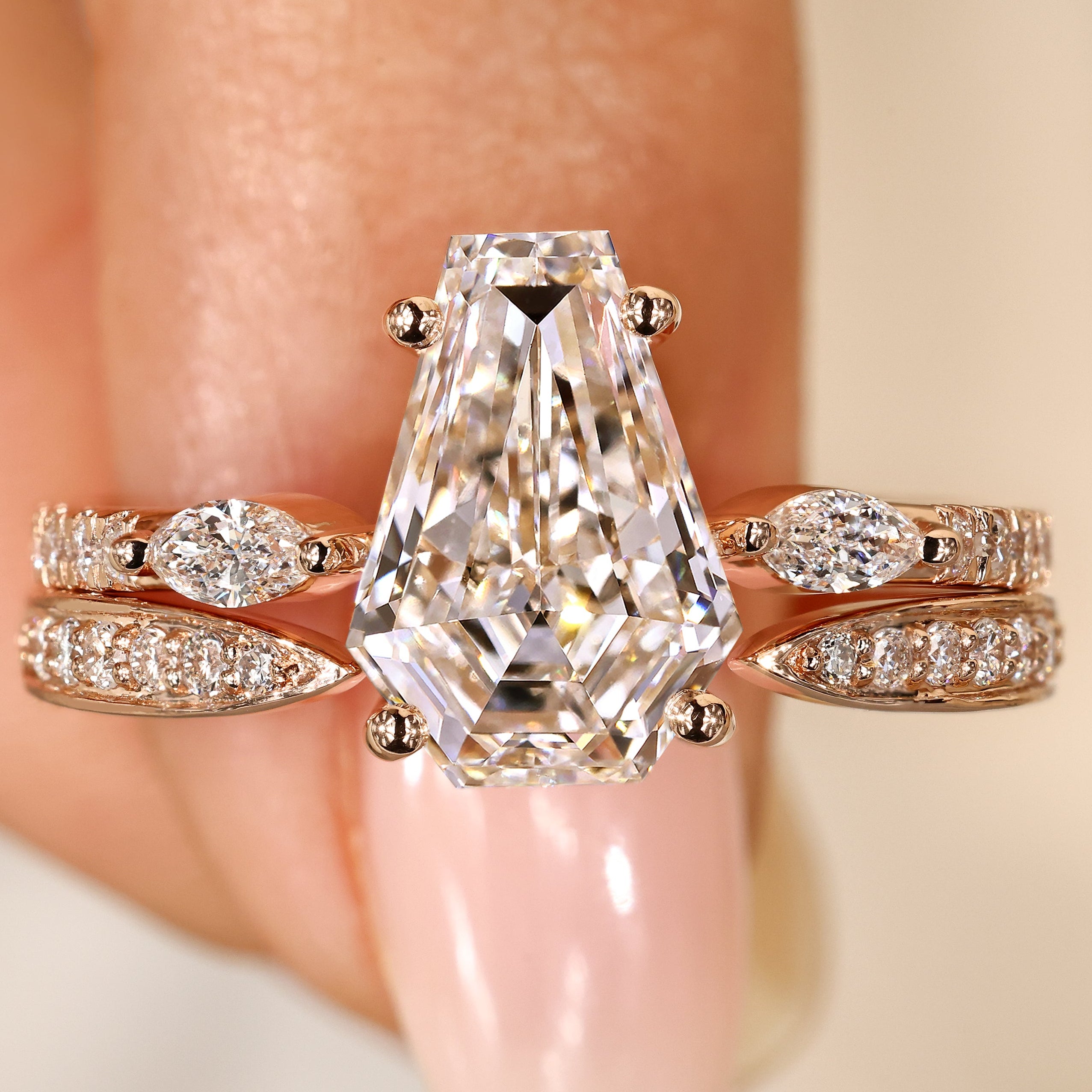 Coffin cut diamond ring with marquise side stones.
