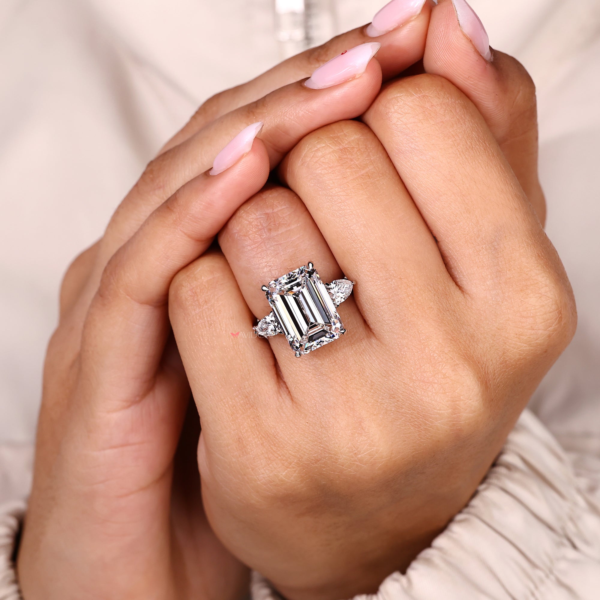 Handmade emerald cut diamond ring with elegant band.
