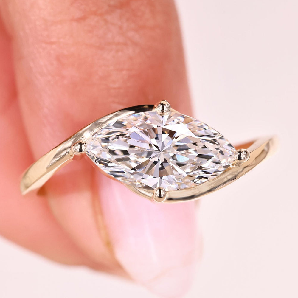 Marquise diamond engagement ring east west style.