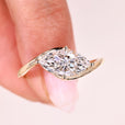 Marquise diamond engagement ring east west style.