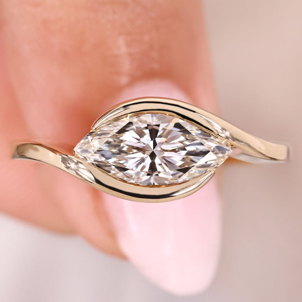 Marquise diamond ring with east west setting.
