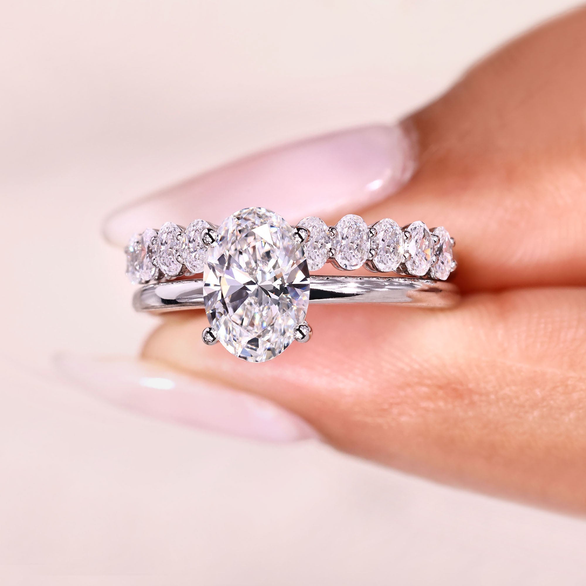 Lab grown oval diamond ring and wedding band.
