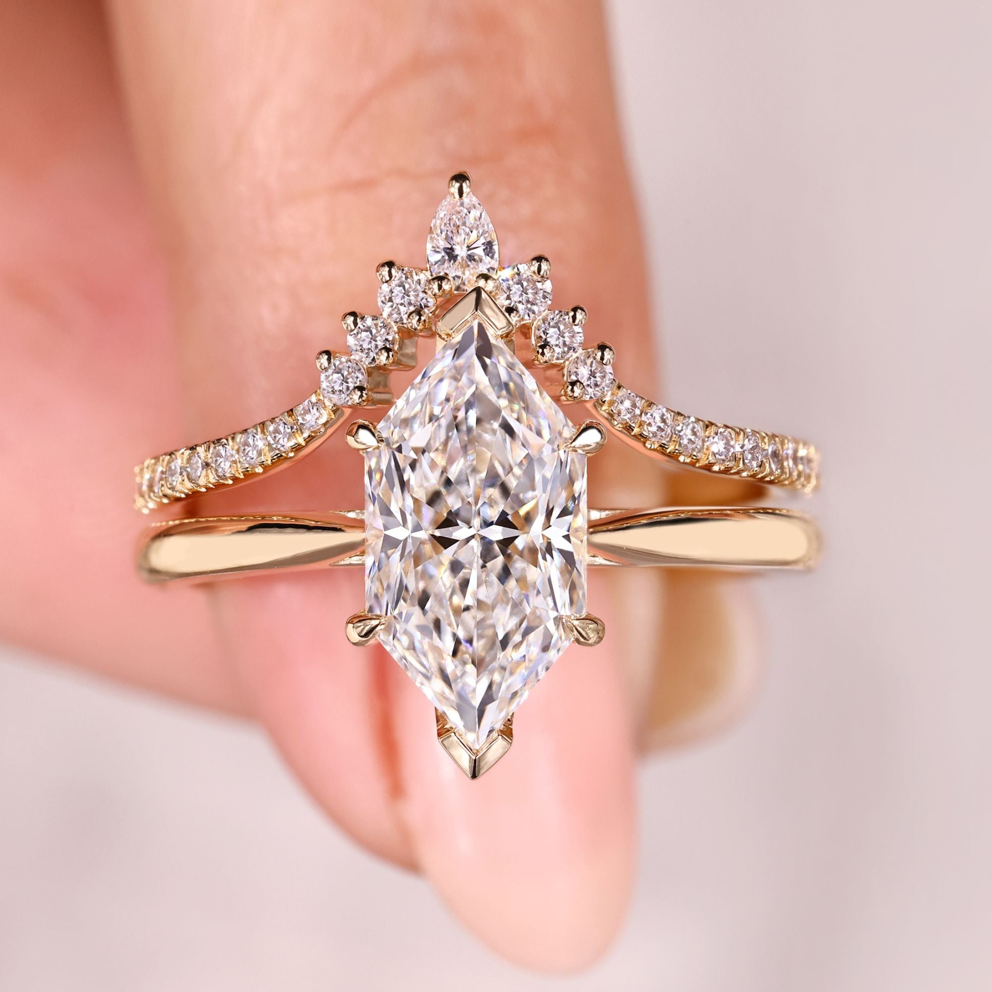 Dutch marquise diamond bridal set with curved band.
