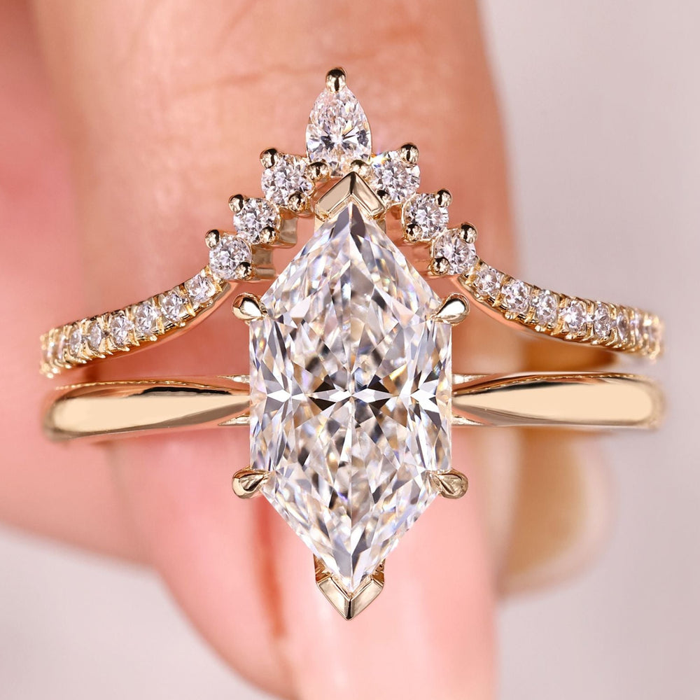 Dutch marquise diamond bridal set with curved band.
