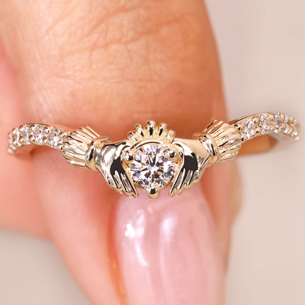 Pave round diamond ring with claddagh style.
