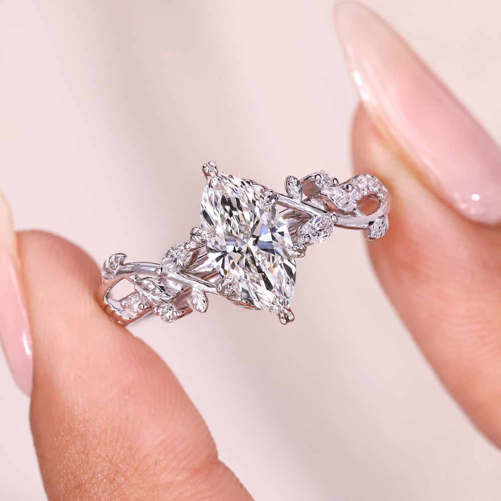 Elegant marquise diamond ring with nature inspired style.
