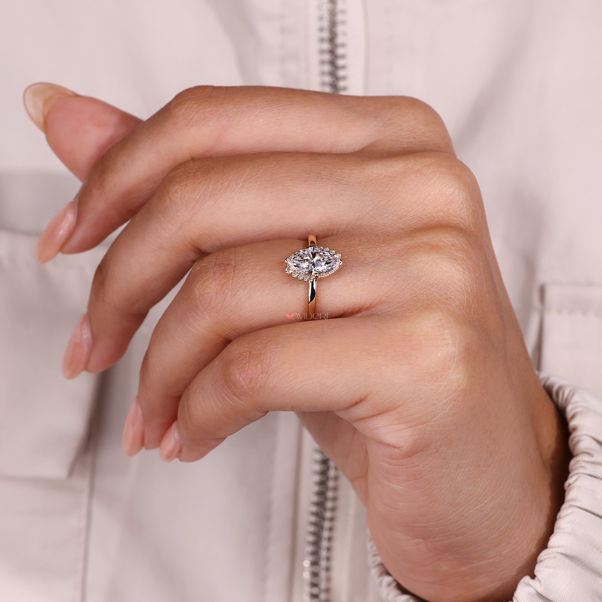 Marquise diamond ring with milgrain setting.
