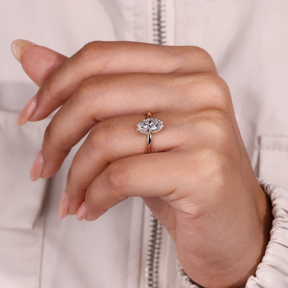 Marquise diamond ring with milgrain setting.

