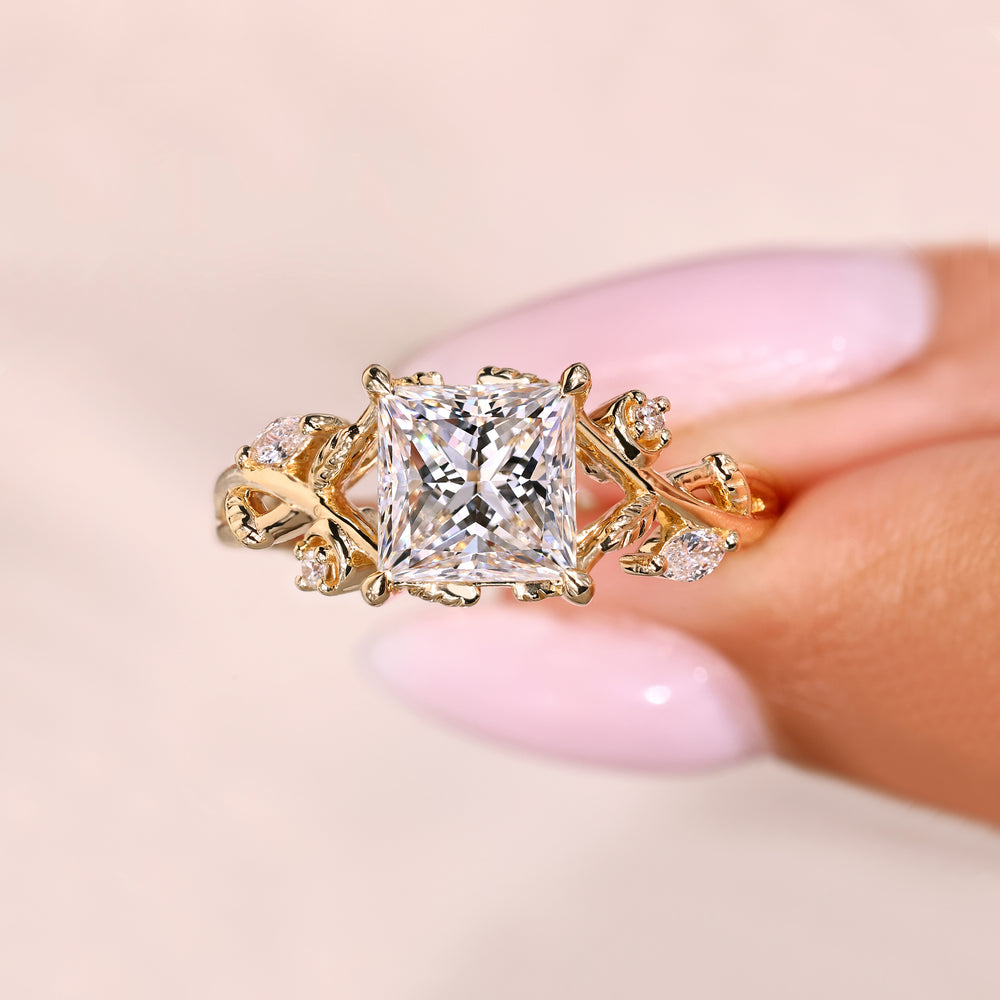 Princess ring with twisted shank and side stones.
