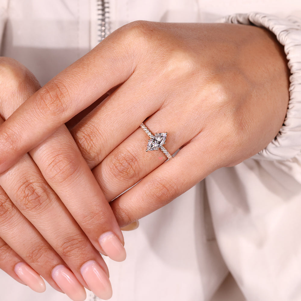 Elegant marquise diamond ring with pave band.
