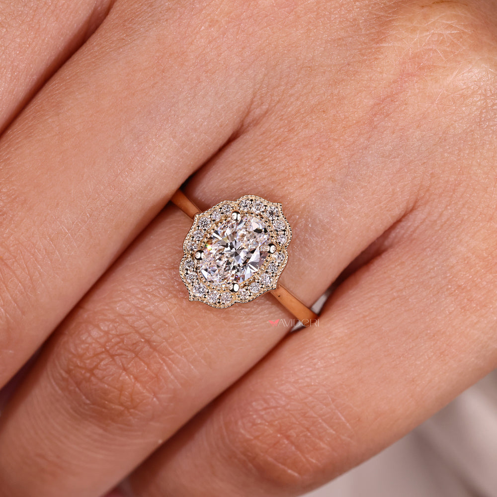 Oval engagement ring with milgrain and halo style.