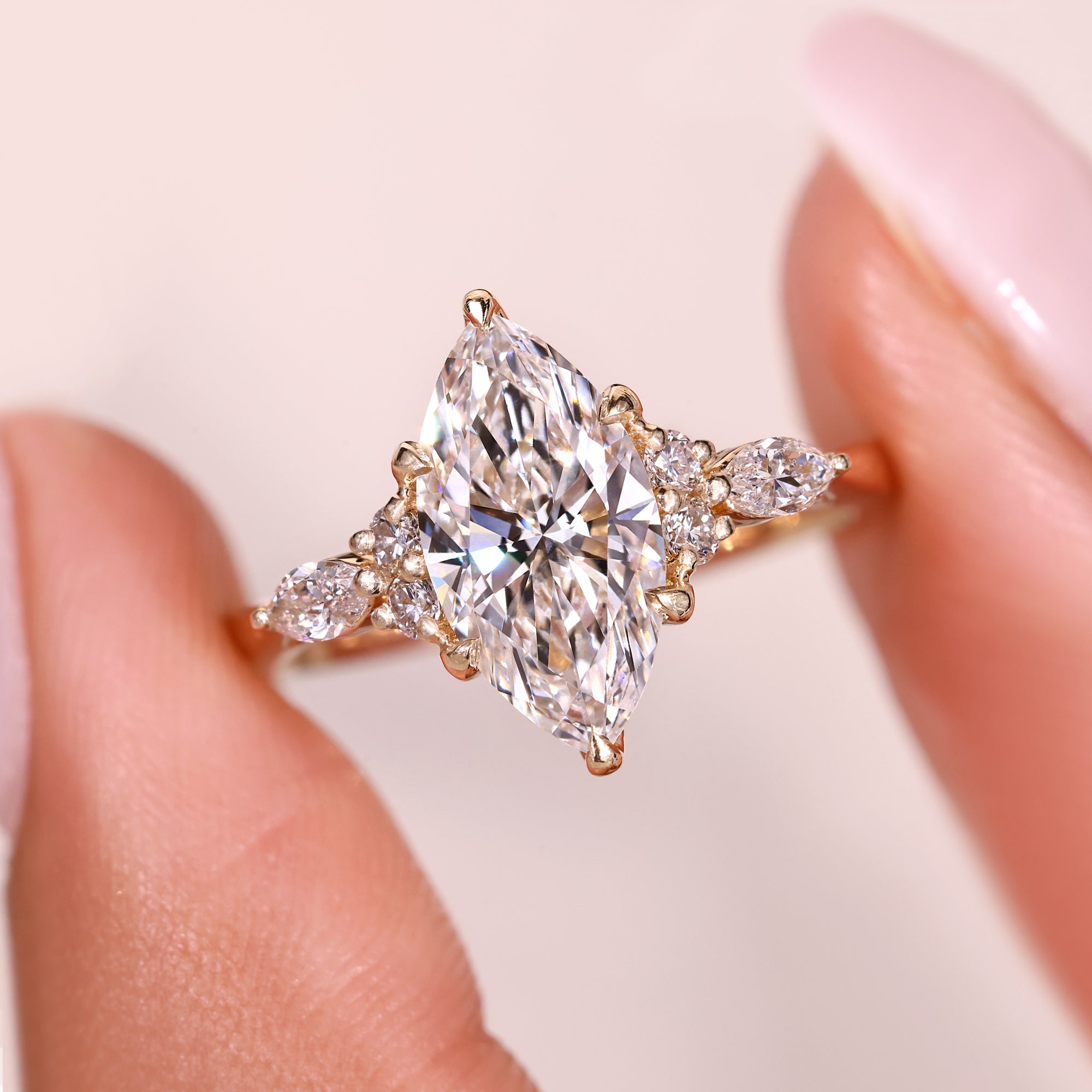 Marquise cut diamond ring with marquise side stones.
