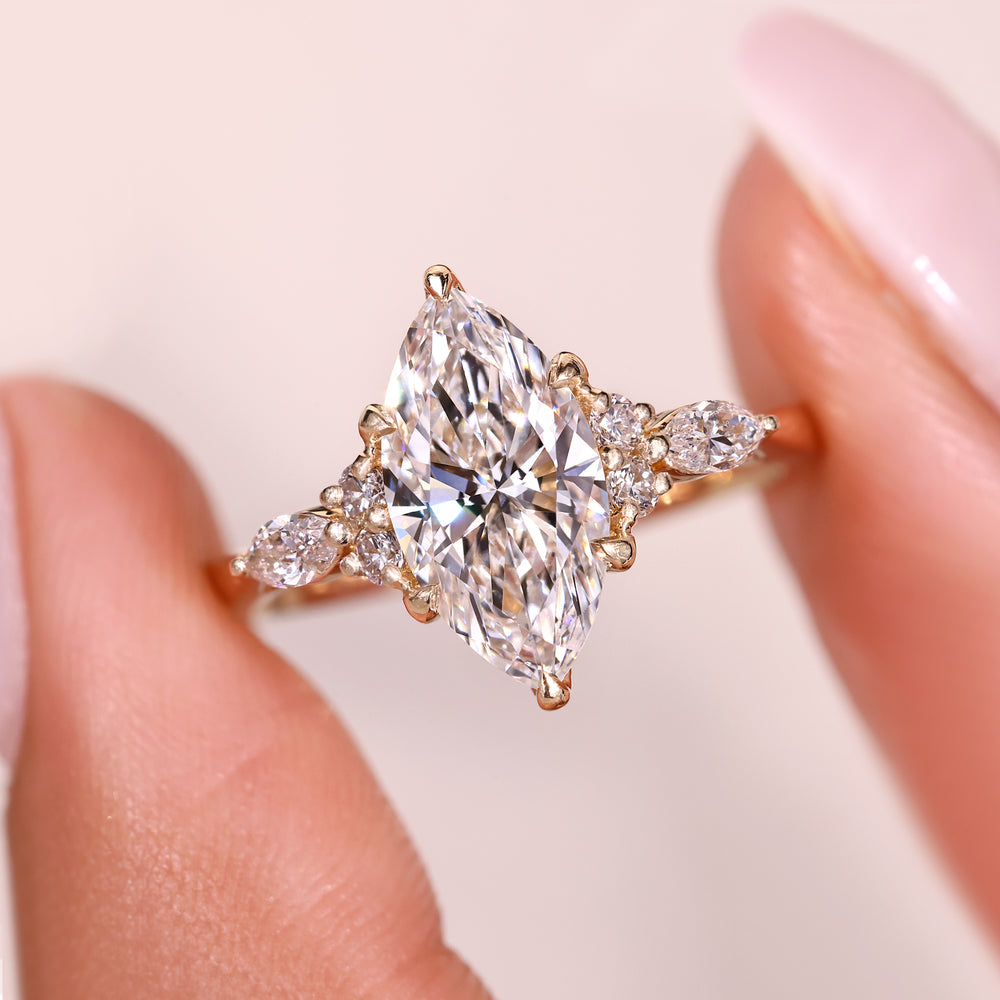 Marquise cut diamond ring with marquise side stones.
