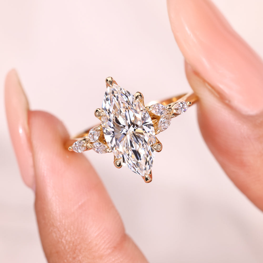 Marquise diamond ring with six claw prong setting.
