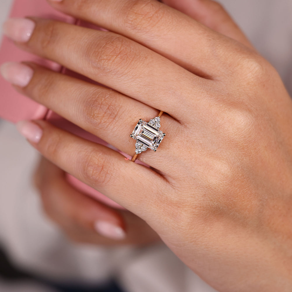 Emerald cut diamond ring in muse setting.
