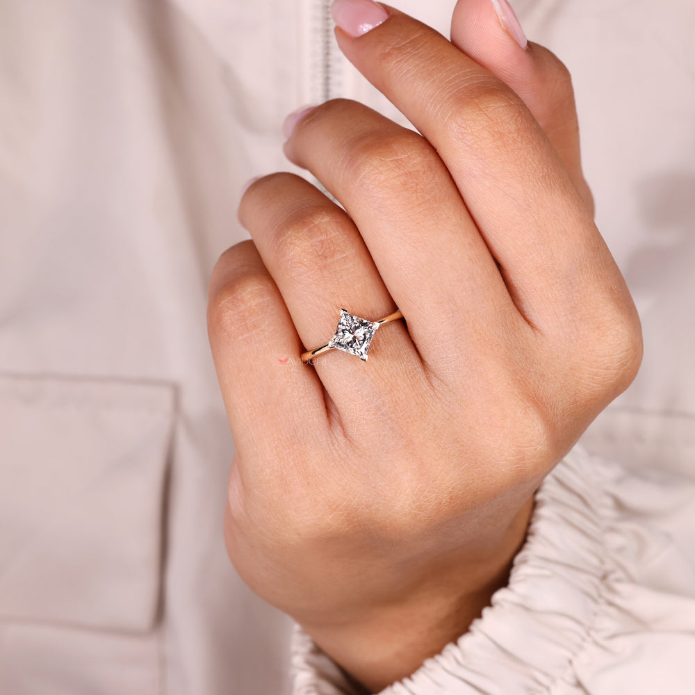 Solitaire princess ring with v prong detail.
