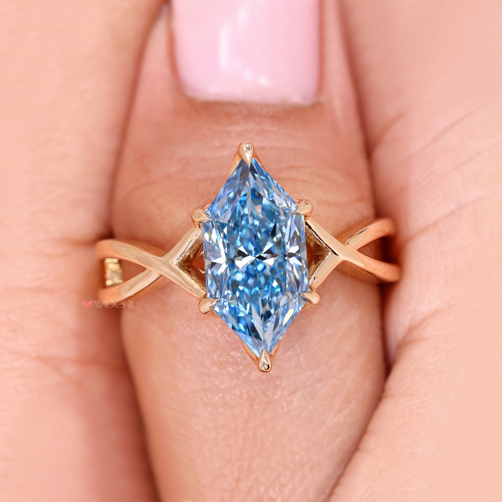 Fancy blue diamond ring with round halo.
