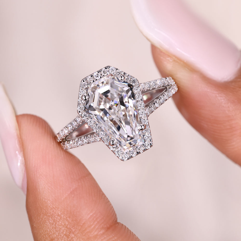 Coffin cut diamond ring with halo and split shank.
