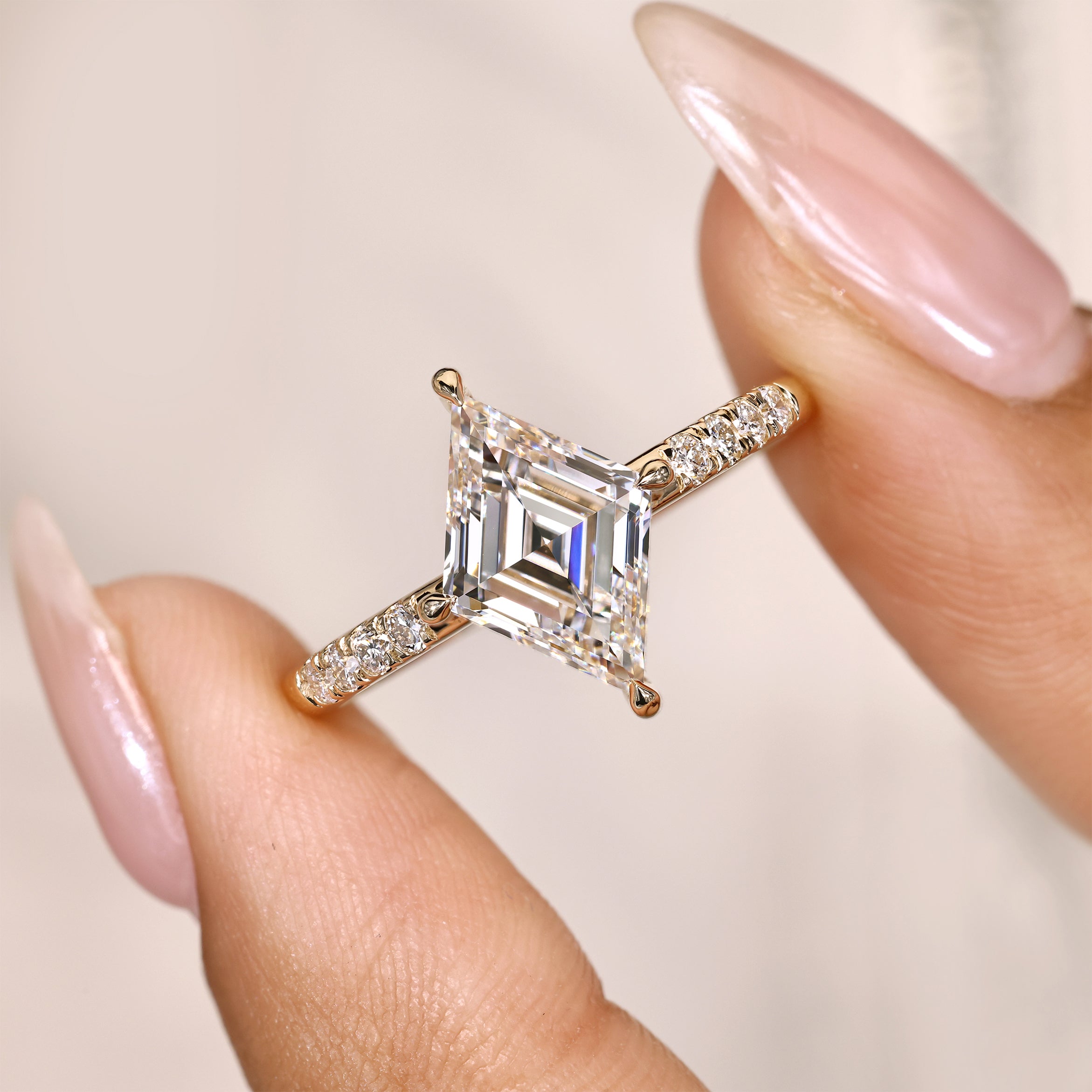 Lozenge cut ring with claw prong setting style.
