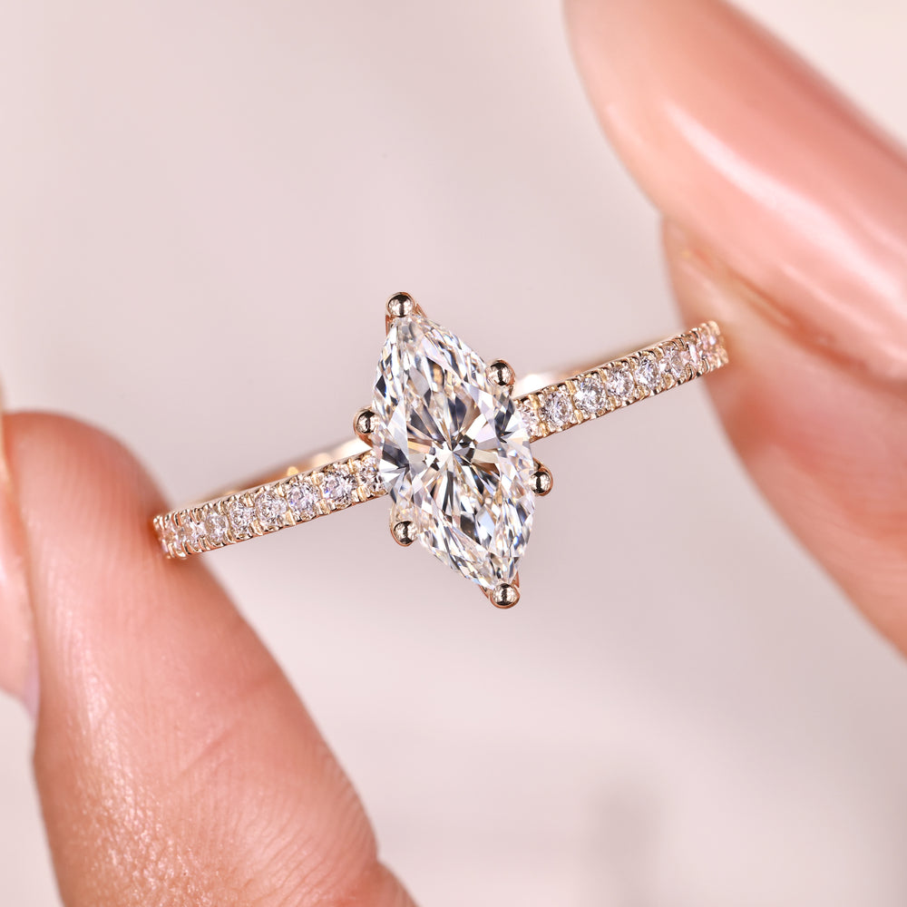 Marquise diamond ring with tulip prong setting.
