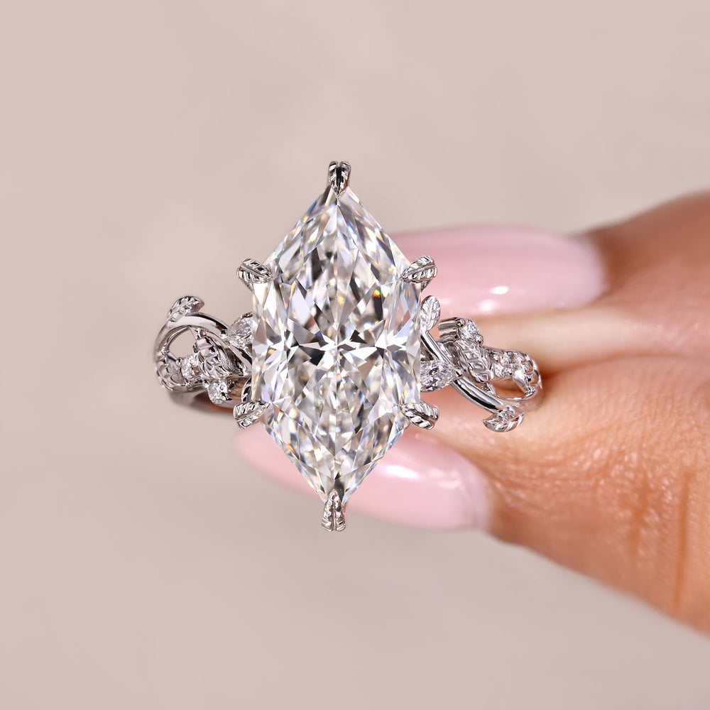 Dutch marquise ring with round side stones.

