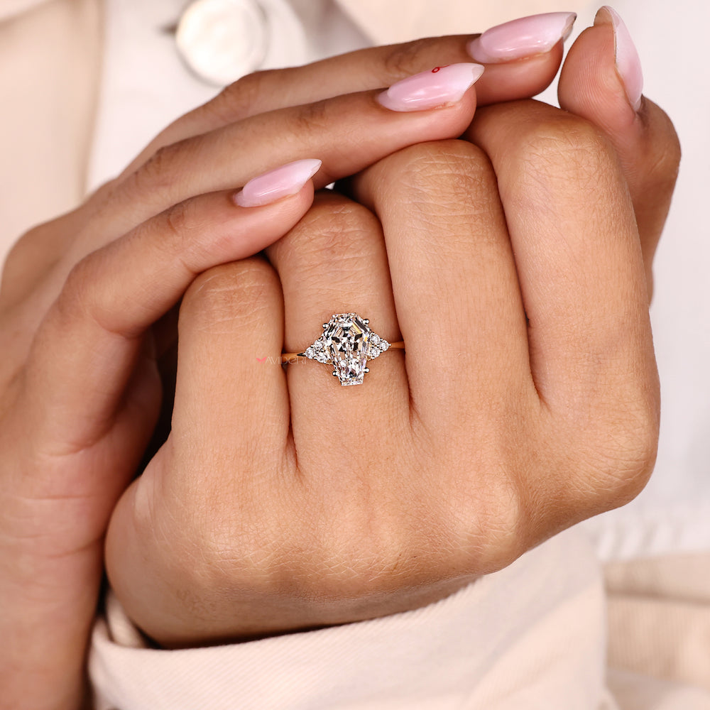 Coffin cut seven stone diamond ring in muse setting.