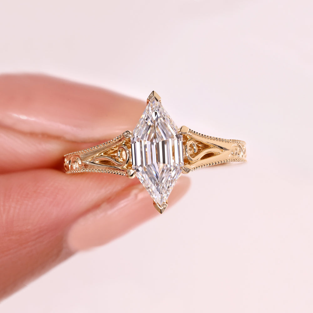 Hexagon diamond ring with cathedral setting.
