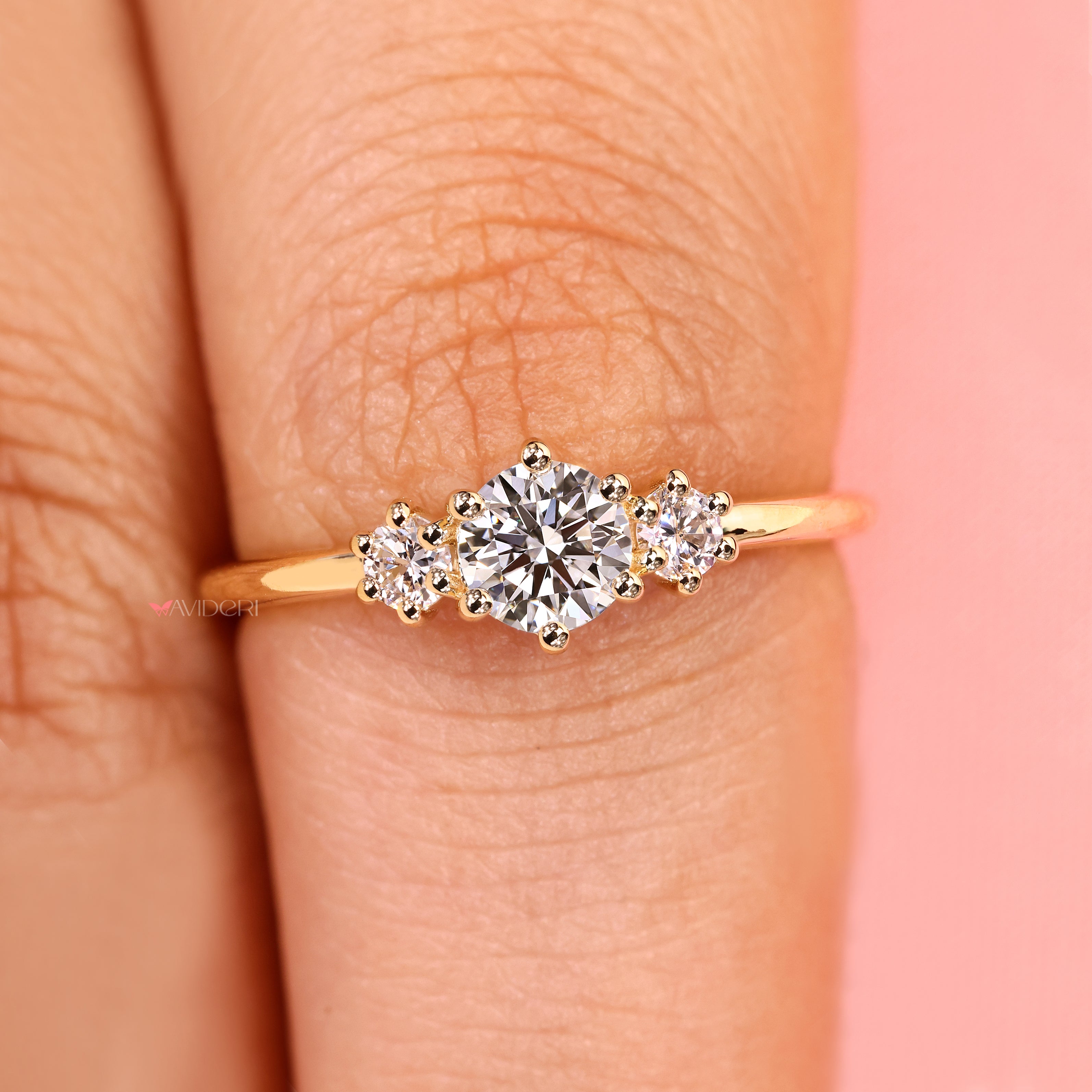 Round diamond ring with prong setting style.
