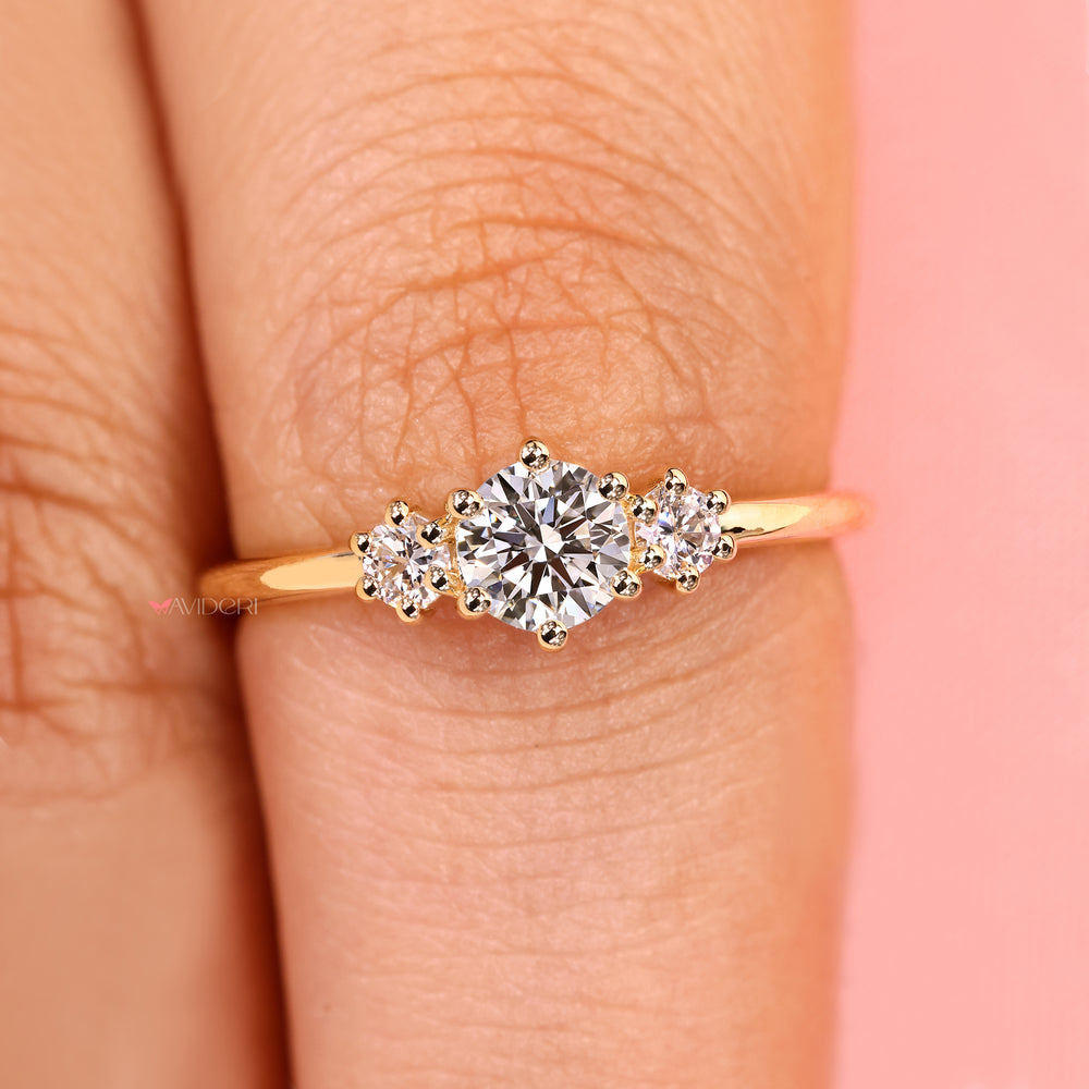 Round diamond ring with prong setting style.
