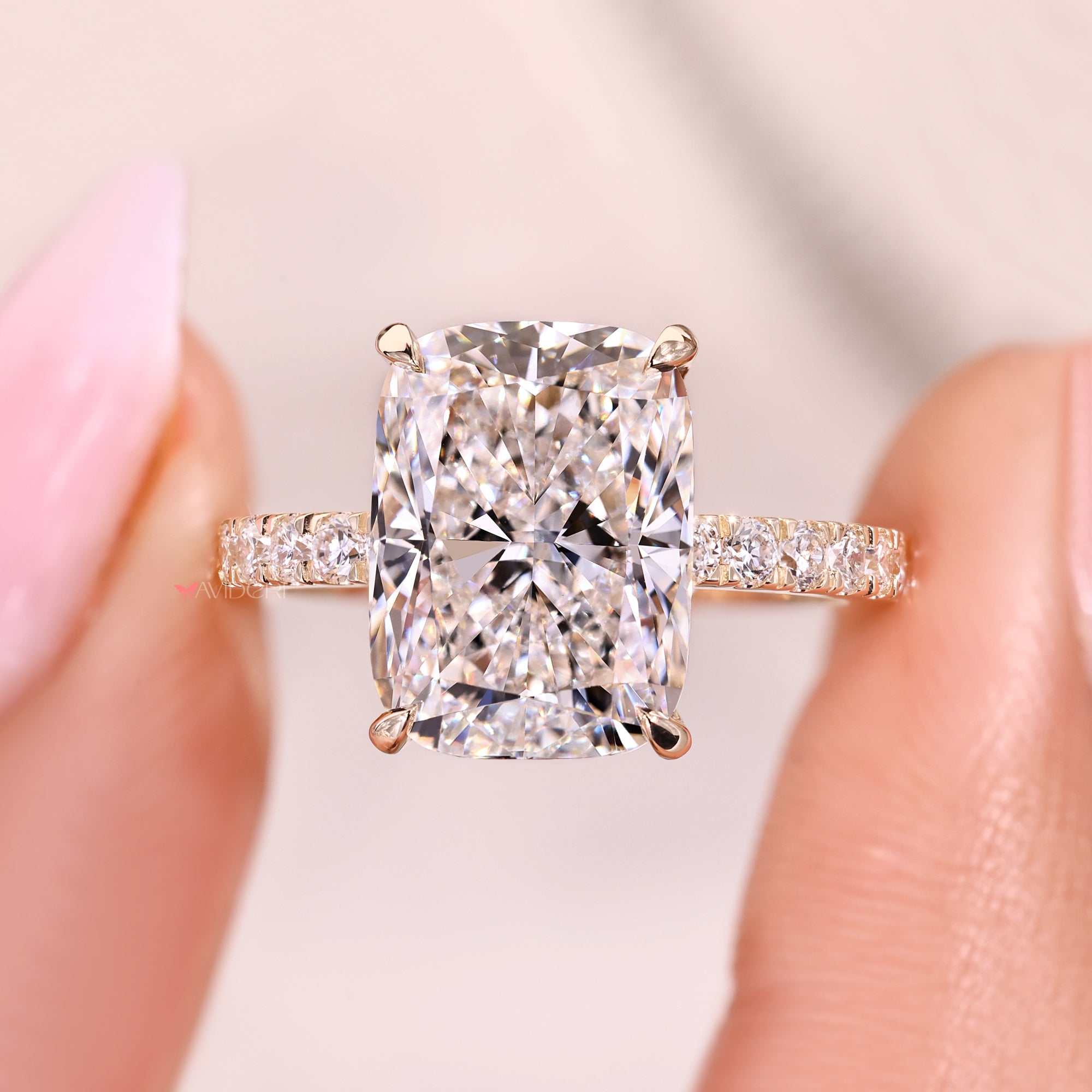 Round diamond pave band cushion cut diamond ring.
