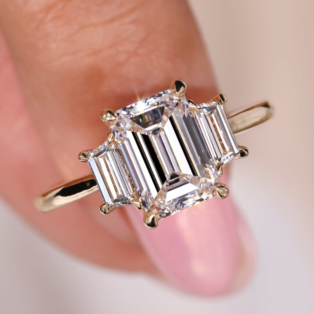Emerald cut diamond ring featuring an elegant emerald engagement ring design.
