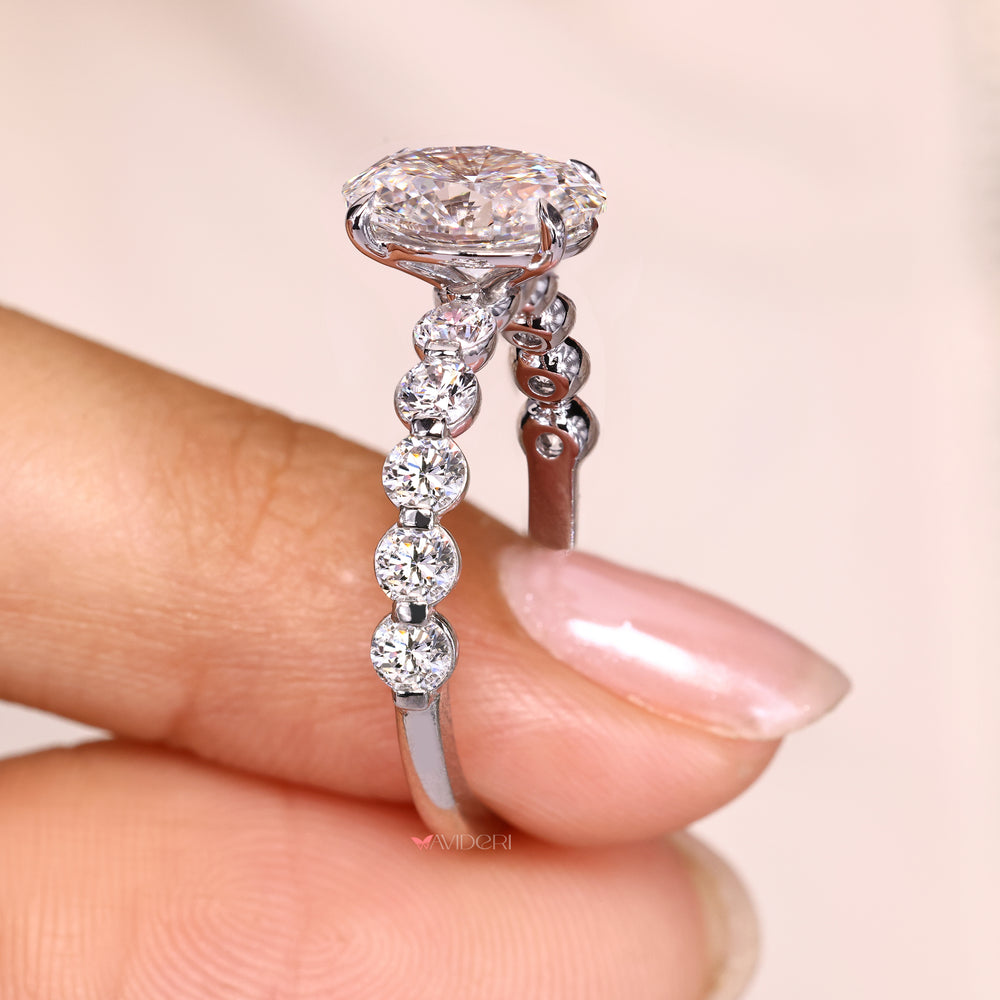 Pave style oval diamond ring with round diamonds.

