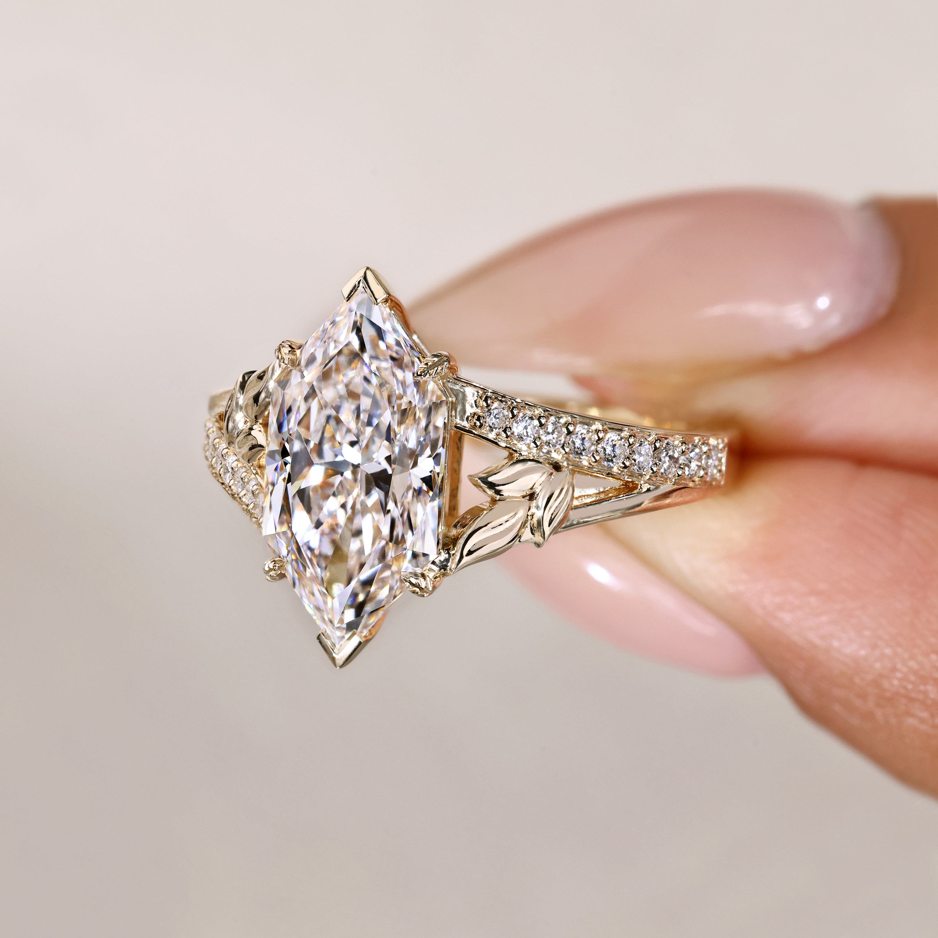 Dutch marquise ring with round diamond pave shank.
