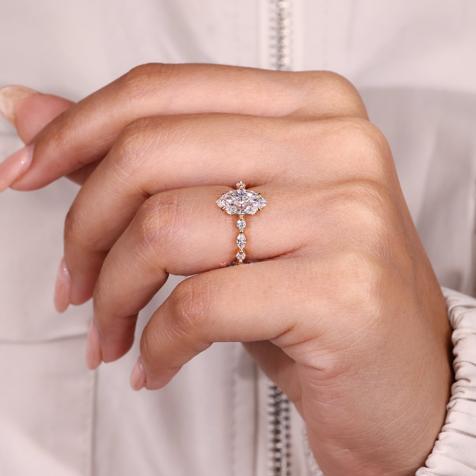 Lab grown Dutch marquise diamond ring with side stones.
