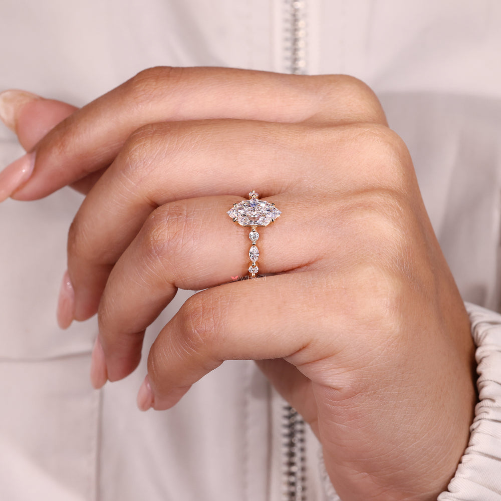 Lab grown Dutch marquise diamond ring with side stones.
