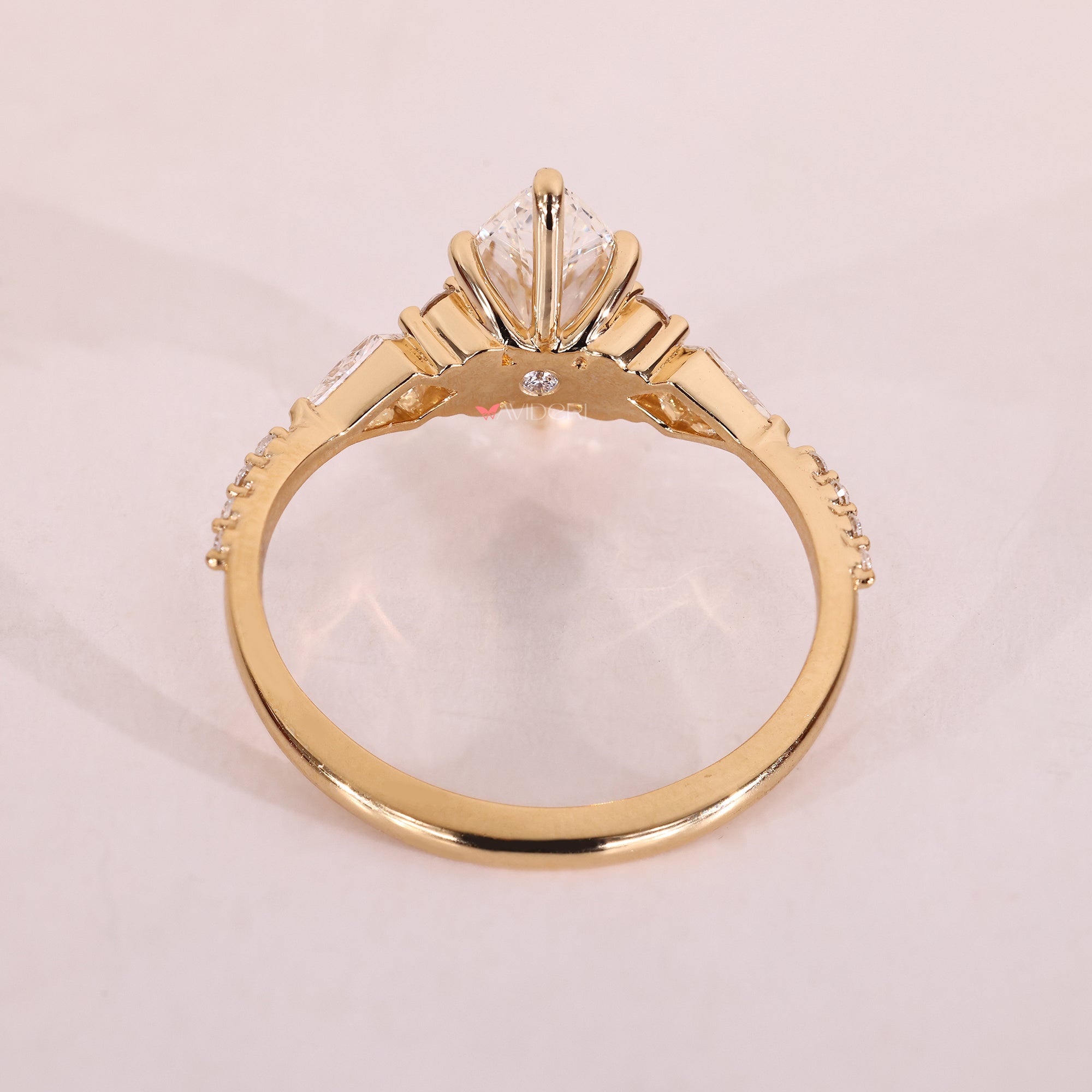 Yellow gold engagement ring with lab grown diamond.