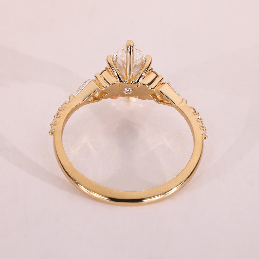 Yellow gold engagement ring with lab grown diamond.