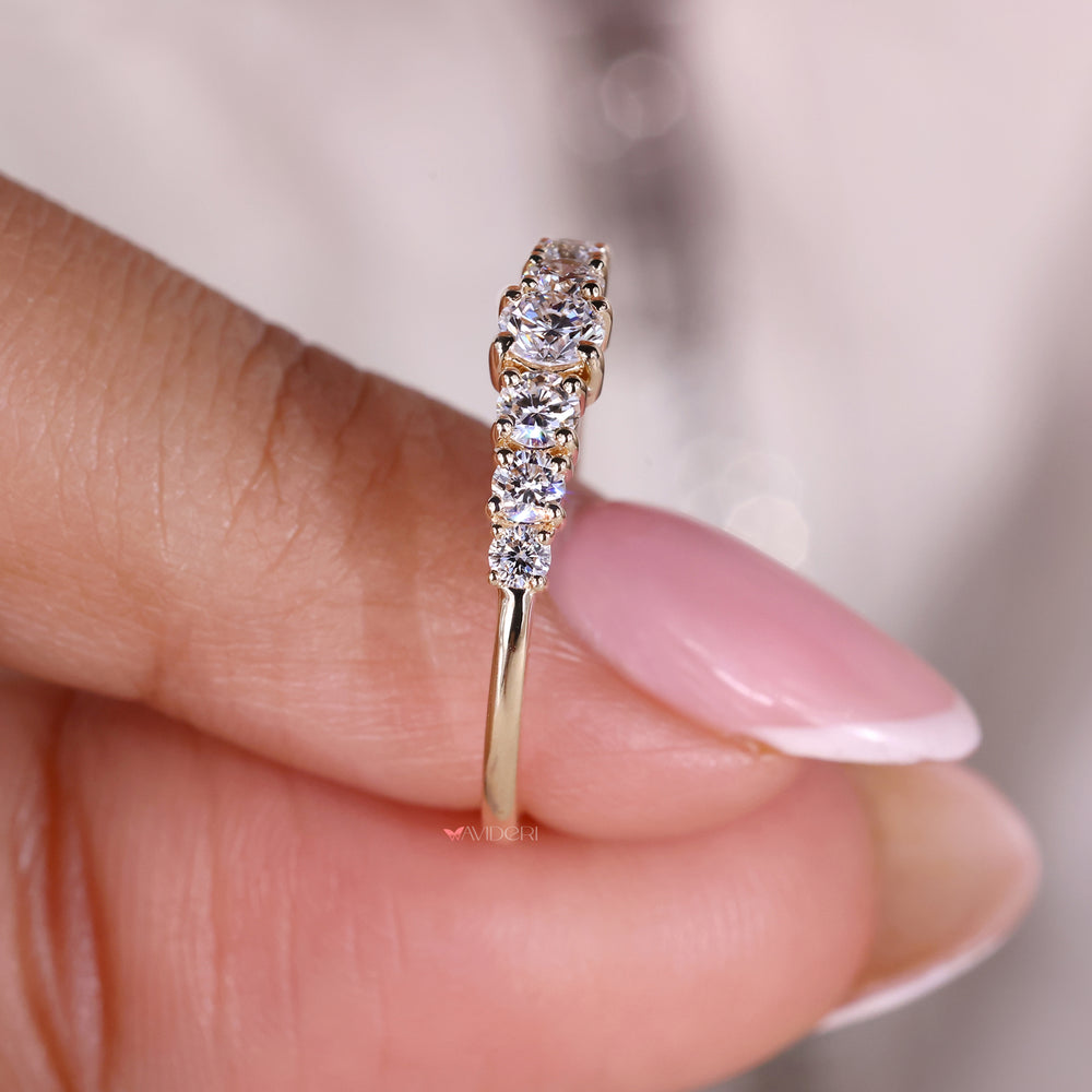 Yellow gold band with classic round diamond accents
