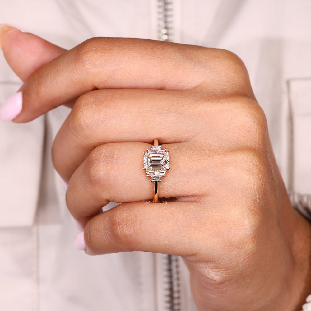 Handmade emerald cut diamond ring with baguette accents
