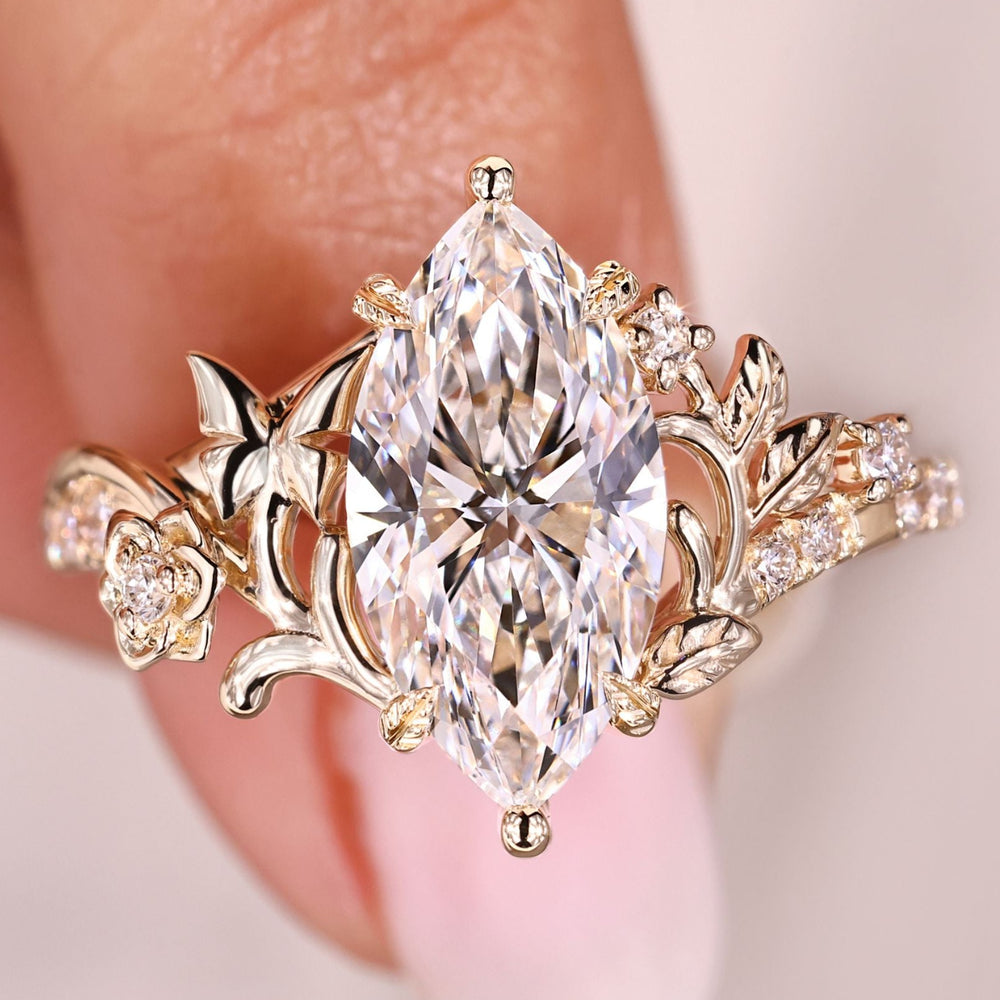 Marquise diamond ring with pave style band.
